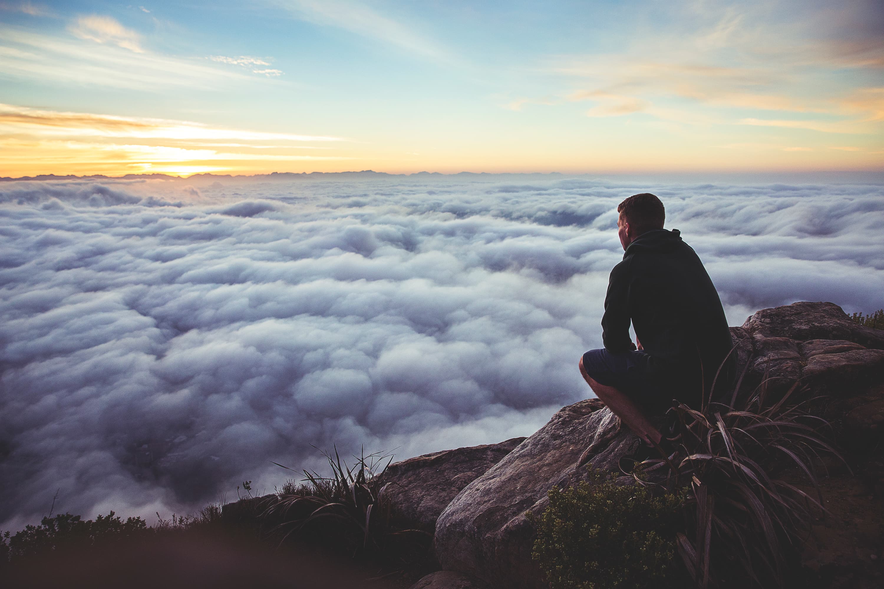Man overlooking clouds
